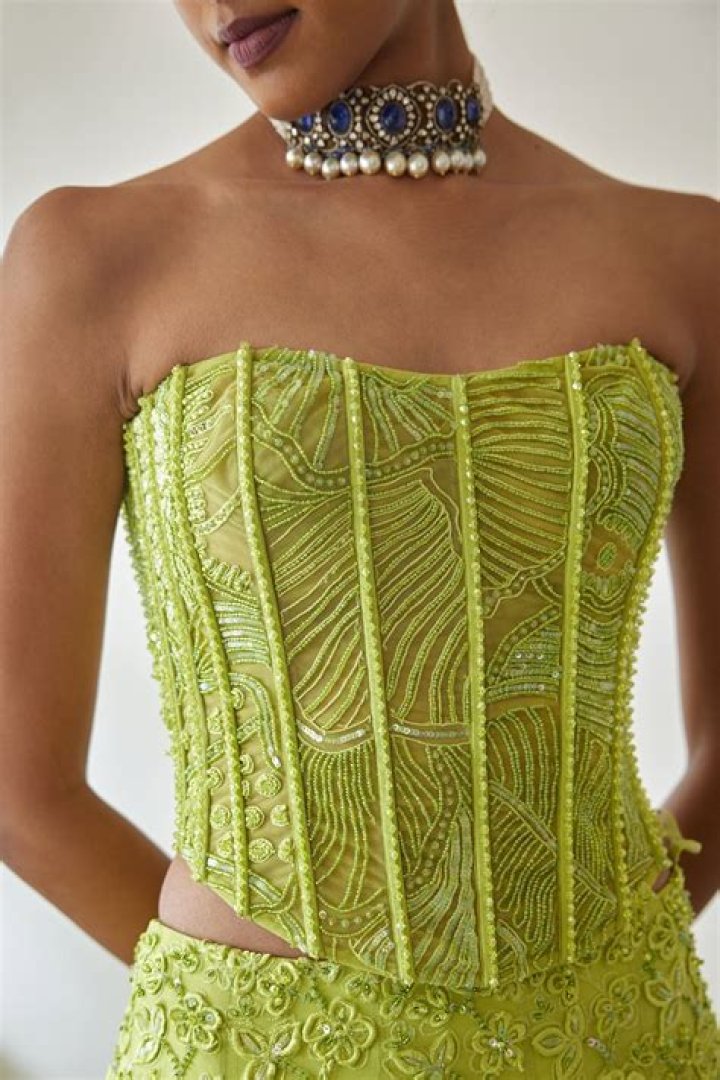 Camila Mendes: Green Corset Top and Skirt